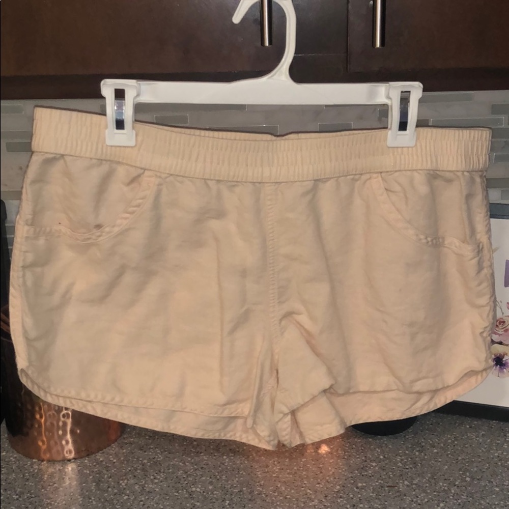 Light elastic banded peach colored shorts